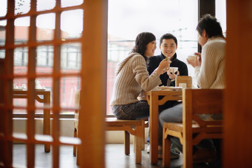 Young couples at a Chinese restaurant, low angle view