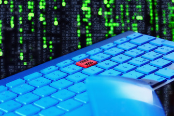 Naklejka premium Close up of keyboard, blue light. Red key for deep web. Selective focus. Black and green technologic background. Keyboard and mouse in foreground. 