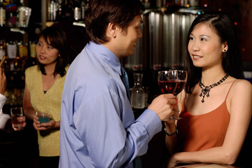 Men and women at bar