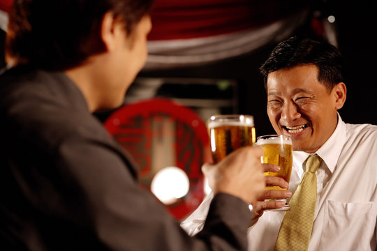 Two men drinking beer together