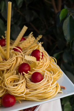 Composition of raw pasta and tomatoes.