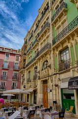 Baroque decoration spanish houses in front of cathedral in Alicante, Spain