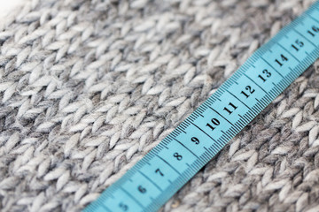 close up of knitted item with measuring tape