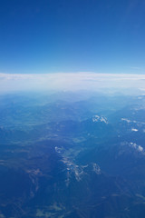 AUSTRIA - October 2016: The alps as seen from an airplane, plane view of mountains.