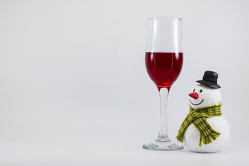Snowman and a glass of red wine