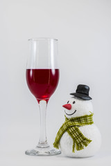 Snowman and a glass of red wine