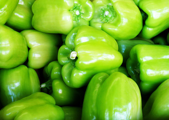 Fresh green sweet peppers background