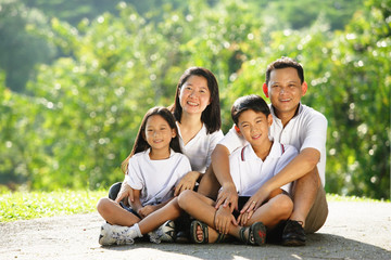 Family looking at camera, smiling