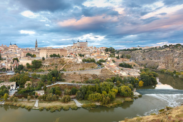 Fototapeta na wymiar Panorama of Old city of Toledo with Cathedral, Alcazar and river Tajo at dusk, Castilla La Mancha, Spain