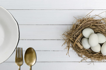 Duck eggs and white plate