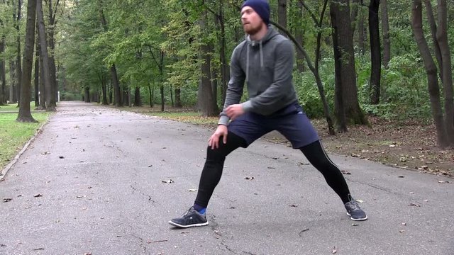 Athletic Man With A Red Beard Training Fitness At Woods 