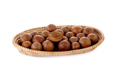 macadamia nuts in basket isolated on white background