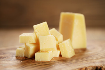 parmesan cubes on olive wooden board