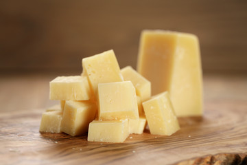 parmesan cubes on olive wooden board