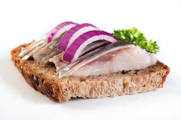 sandwich with slices of herring on a white background