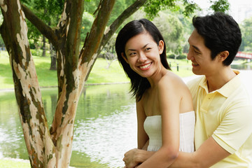 Man hugging woman from behind