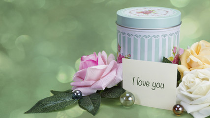 Word on paper, Gift jar, jar and next flowers, green background