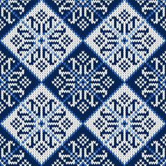 knitted seamless pattern with snowflakes in blue
