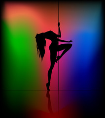 Silhouette of young beautiful woman dancing a striptease