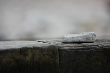 White stone on a brown wood 