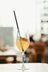 iced cocktail with orange slice on the unfocused background 