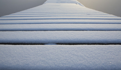 Snow covered slide. Ice surrounding.