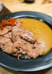 Japanese beef curry tasty in black plate