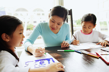 Mother with two girls, drawing