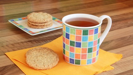 Cup of tea with wholemeal biscuits.