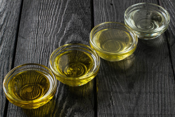 Different types of vegetable oil in glass bowls