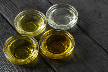 Different types of vegetable oil in glass bowls