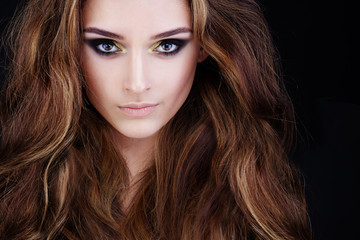 Glamorous Woman with Long Permed Hair and Smokey Eyes Makeup