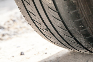 screw puncturing car tire