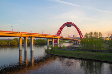 Fototapeta na wymiar Picturesque bridge - arch, steel cable-stayed bridge across the Moscow river, is located in the West of Moscow