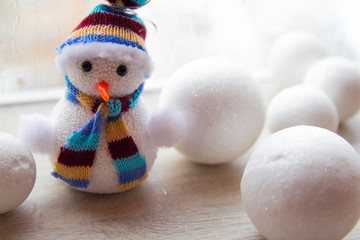 the little toy snowman toy as a decoration for the new year and Christmas, next white toy snow globes