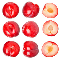 Red ripe plums isolated on white background. Useful vitamins.
