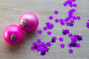 two pink bowl on wooden background. top view, as a symbol of the new year, there is a place for the text