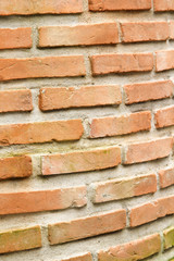 Orange brick wall of artesian well.