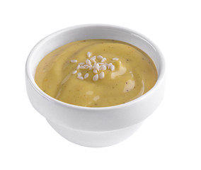 salad dressing in white bowl on white background