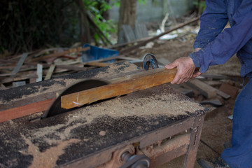 Carpenter tools on wooden table with sawdust. Circular Saw. Carp