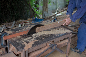 Carpenter tools on wooden table with sawdust. Circular Saw. Carp