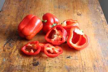 Red Bell Peppers on a Wooden Table