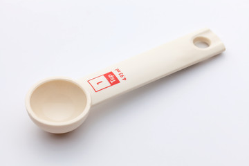 measuring spoon on white background