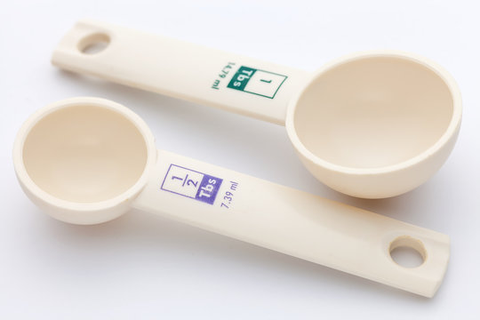 measuring spoons on white background