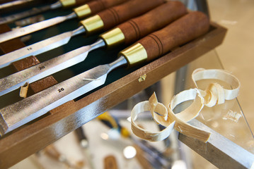 Steel blades many chisels and sawdust chippings