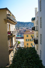 Fototapeta na wymiar Cityscape of Nice, France view to port from yard