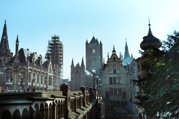 Beautiful skyline of Ghent, Belgian city, tourists walking. Beautiful skyline of Ghent, Belgian city, tourists walking. Cityscape of Ghent  - old European Belgian city - misty morning in autumn. 