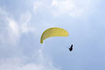 Paragliding in front of blue sky