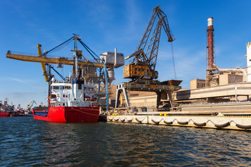 Loading phosphate fertilizers in the port of Gdansk, Poland.