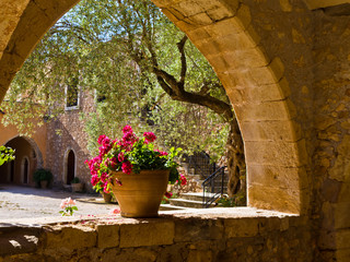 Flowerpot in a monastery with beautifull magenta flowers